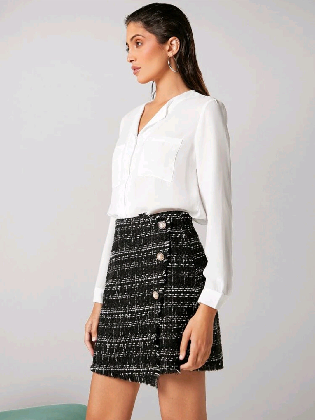 Falda de talle alto con patron de cuadros, con boton tweed, con cierre